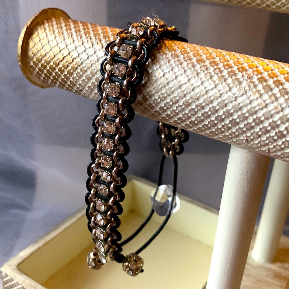 Adjustable crystal, silver, and black leather cord